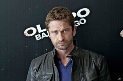 Scottish actor Gerard Butler poses during a photo call promoting his new movie, "Olympus Has Fallen," in Mexico City, Friday, April 12, 2013. The American action-thriller film directed by Antoine Fuqua premiers in the Mexican capital Friday. (AP Photo/Eduardo Verdugo)